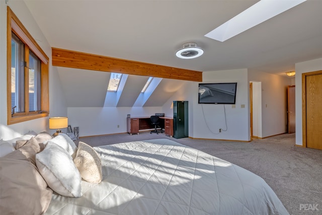 bedroom featuring light colored carpet and lofted ceiling with skylight