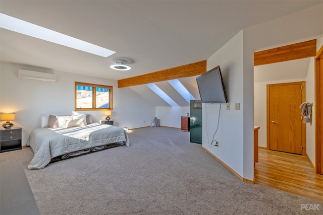 bedroom featuring a wall unit AC, light carpet, and lofted ceiling with skylight