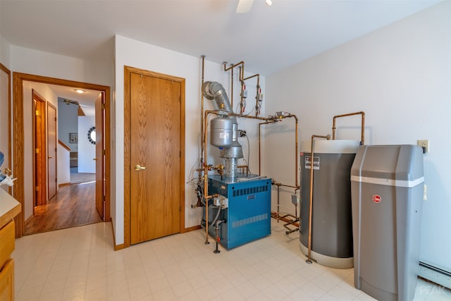 utility room with a baseboard heating unit and gas water heater