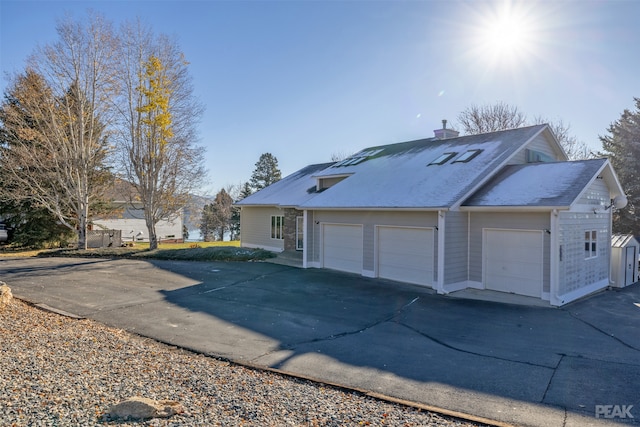 view of side of property featuring a garage