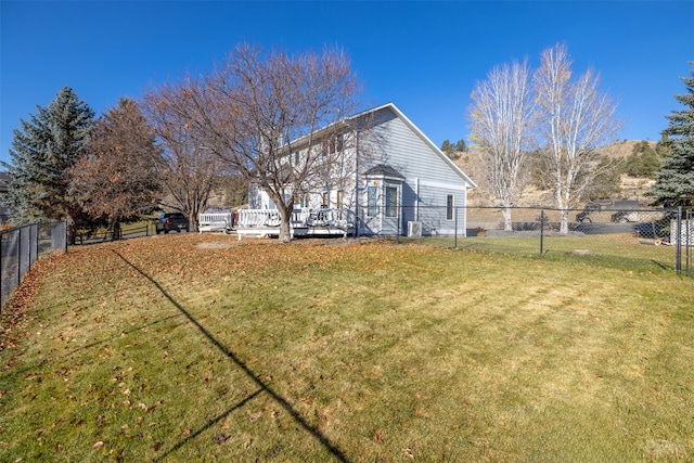 view of yard featuring a wooden deck