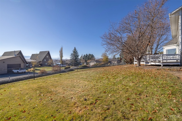 view of yard featuring a wooden deck