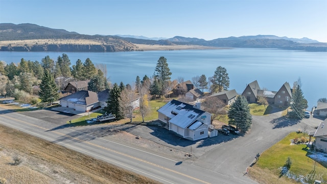 birds eye view of property featuring a water and mountain view