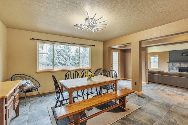 dining area with a textured ceiling