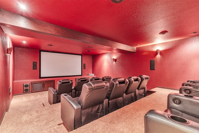 carpeted cinema with a textured ceiling and beam ceiling