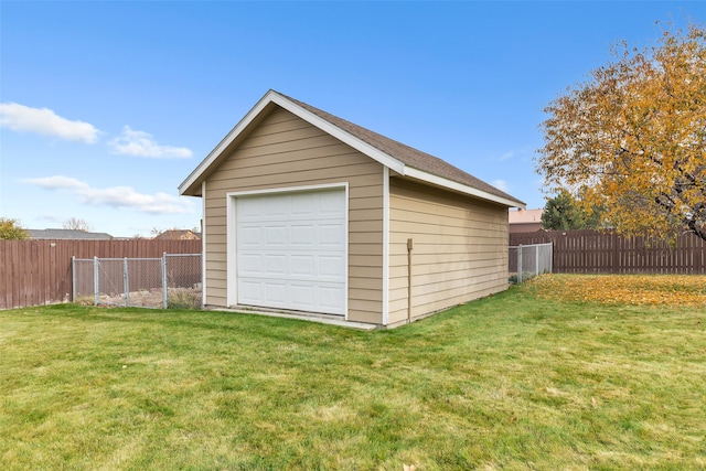 garage featuring a yard