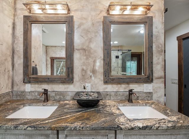 full bath with double vanity and a sink