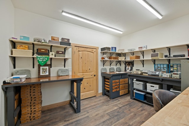 office with dark wood-type flooring