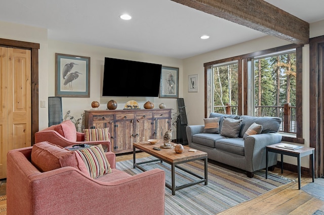 living room featuring light wood-style flooring and recessed lighting