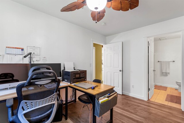 office area with hardwood / wood-style floors and ceiling fan