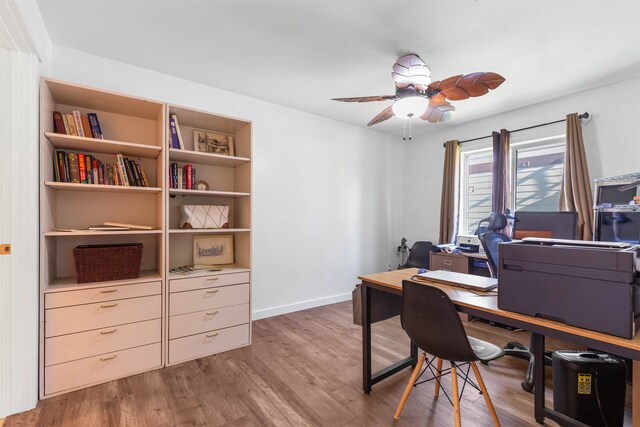 office space with dark hardwood / wood-style floors and ceiling fan