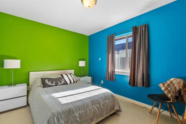 bedroom featuring light colored carpet