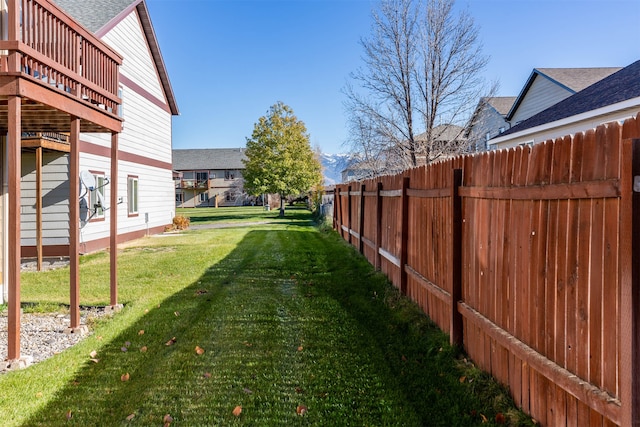 view of yard with a wooden deck