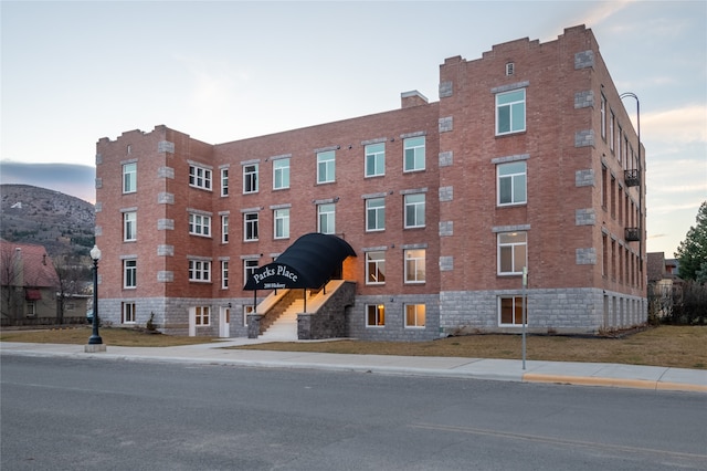 view of outdoor building at dusk