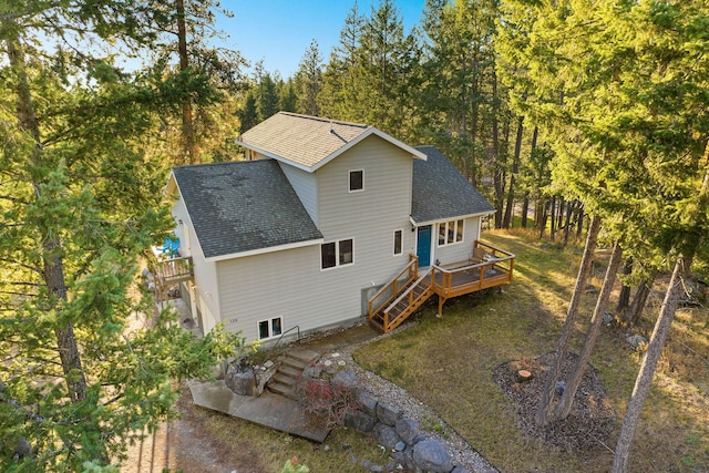 128 Ledgewood Dr, Bigfork, MT 59911 - back of property with roof with shingles and a wooden deck