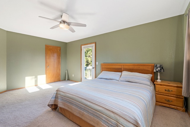 bedroom featuring access to exterior, ceiling fan, and light carpet