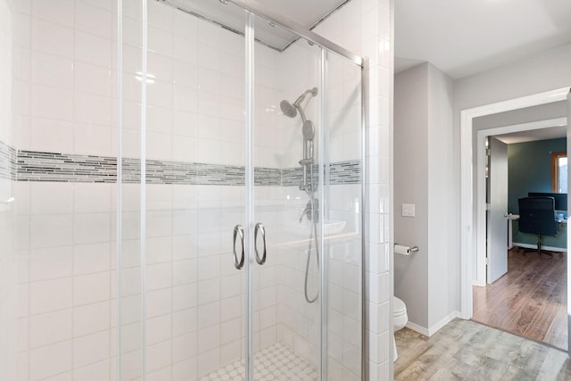 128 Ledgewood Dr, Bigfork, MT 59911 - bathroom with a stall shower and wood finished floors