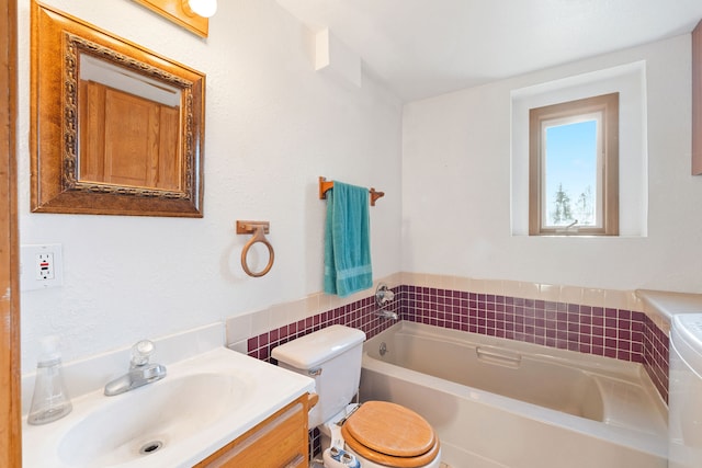 bathroom with a bathing tub, decorative backsplash, vanity, and toilet