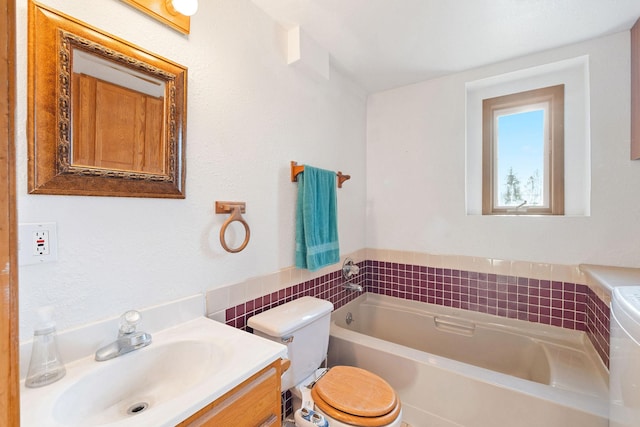 128 Ledgewood Dr, Bigfork, MT 59911 - full bathroom featuring a garden tub, vanity, and tile walls