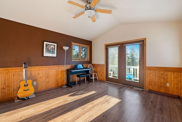 128 Ledgewood Dr, Bigfork, MT 59911 - office featuring wainscoting, wood finished floors, wood walls, lofted ceiling, and a ceiling fan