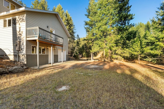 128 Ledgewood Dr, Bigfork, MT 59911 - view of yard featuring a deck and an attached garage