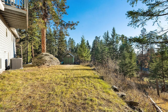 128 Ledgewood Dr, Bigfork, MT 59911 - view of green lawn featuring a storage shed