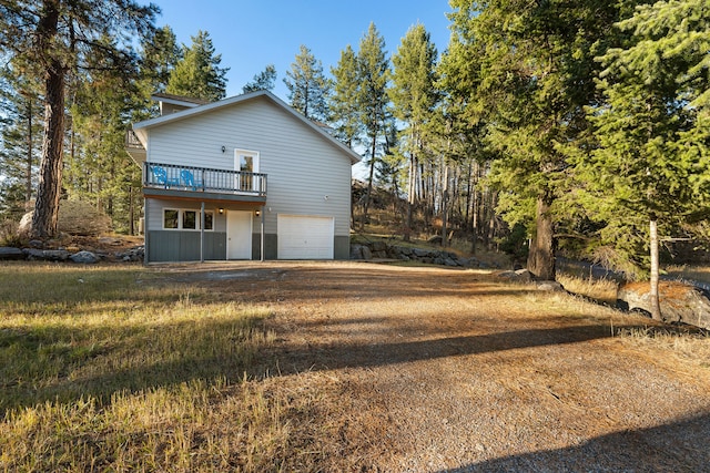 exterior space with a garage and a deck