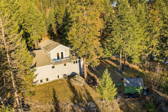 128 Ledgewood Dr, Bigfork, MT 59911 - view of subject property featuring a heavily wooded area