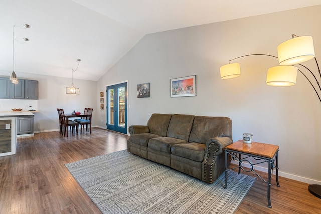 living room with hardwood / wood-style floors and lofted ceiling