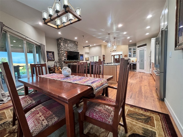 dining room featuring light hardwood / wood-style flooring and an inviting chandelier