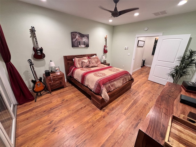 bedroom with ceiling fan and light wood-type flooring