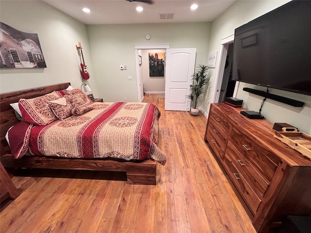 bedroom with light hardwood / wood-style floors