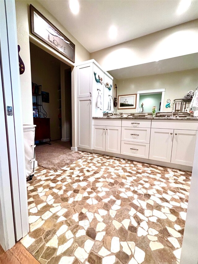 kitchen featuring white cabinets