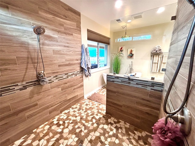 bathroom featuring walk in shower