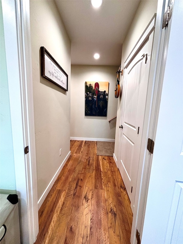 hall with wood-type flooring