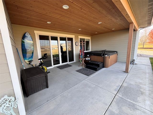 view of patio / terrace featuring a hot tub