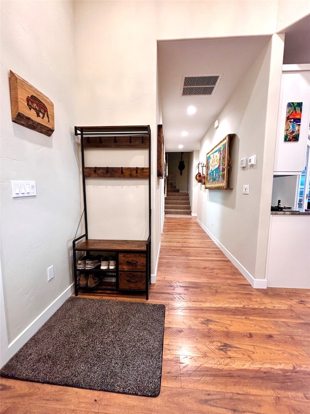 hallway featuring wood-type flooring