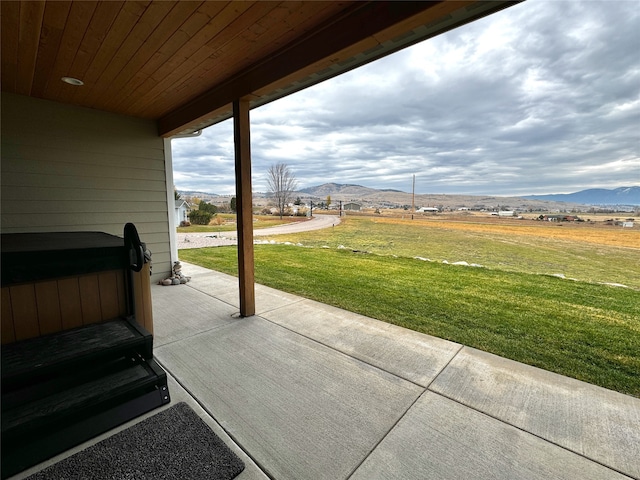 view of patio / terrace with a mountain view