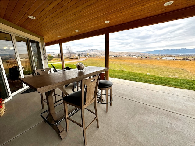 view of patio featuring a mountain view and a rural view