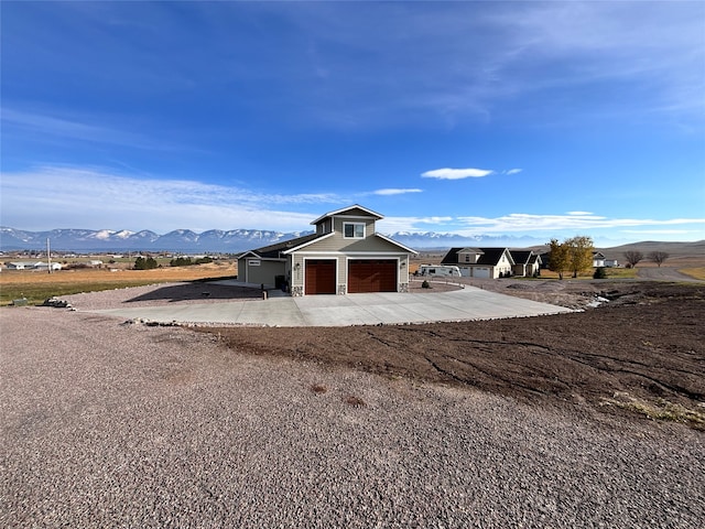 view of outbuilding with a mountain view and a garage