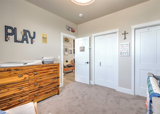 carpeted bedroom with a closet