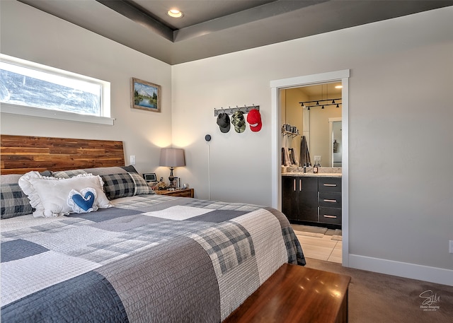 tiled bedroom featuring connected bathroom