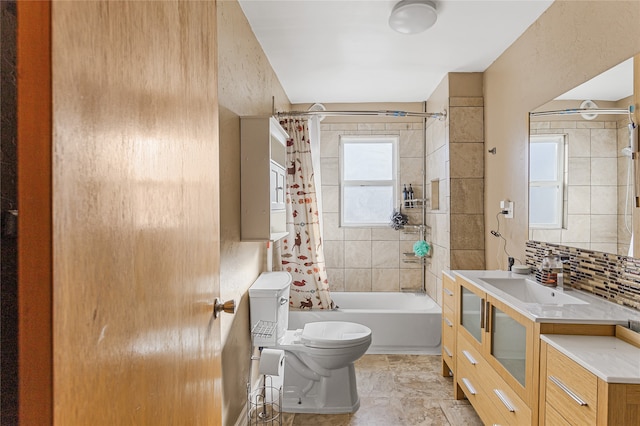 full bathroom with shower / tub combo with curtain, vanity, backsplash, and toilet