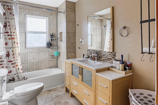 bathroom featuring a textured wall, toilet, vanity, backsplash, and shower / tub combo with curtain