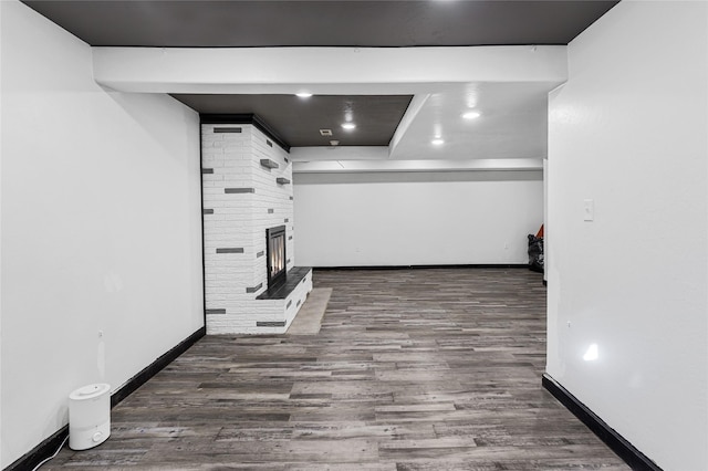 interior space featuring wood finished floors and baseboards