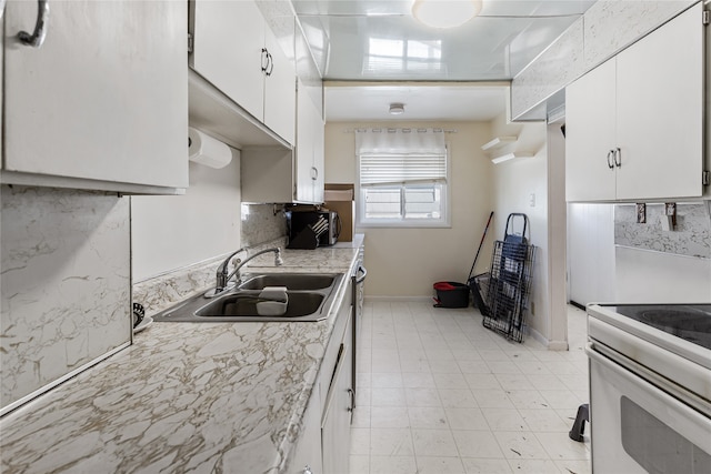 kitchen featuring white cabinetry, sink, and white electric range oven