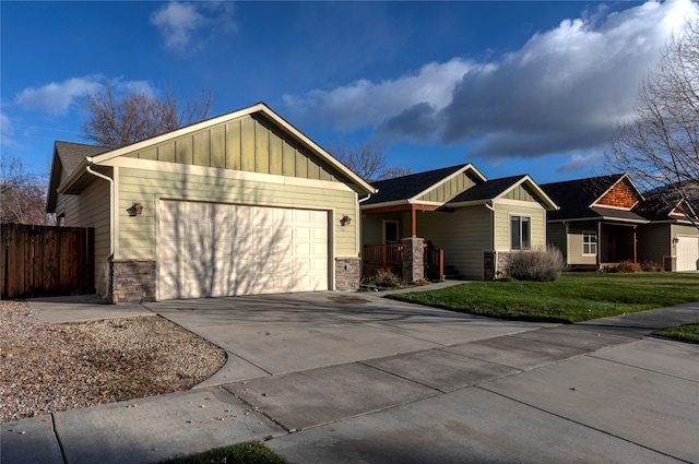 single story home with a garage and a front lawn