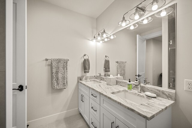 bathroom featuring tile patterned flooring and vanity