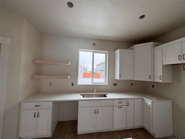 kitchen with sink, dark hardwood / wood-style floors, and white cabinets