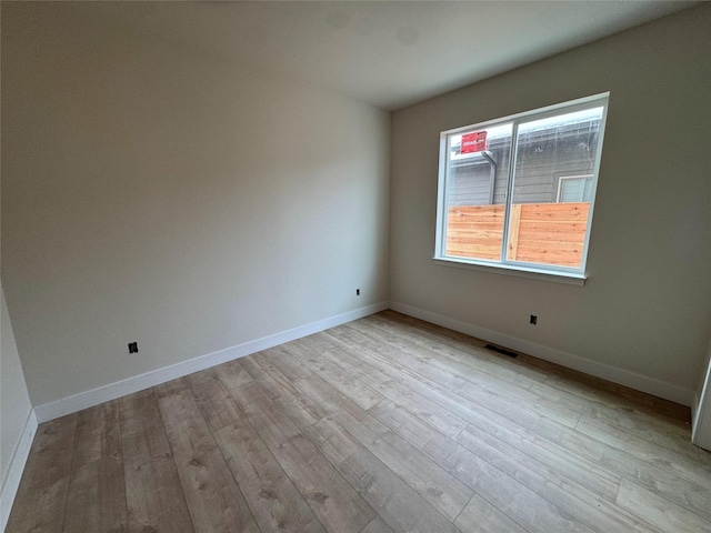 unfurnished room featuring light hardwood / wood-style flooring